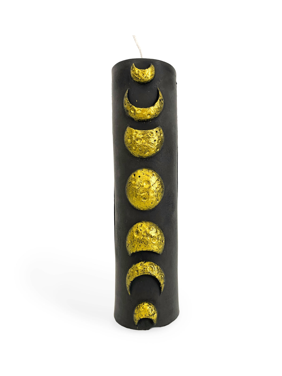 The Golden Moon Phase Pillar Candle by A Pleasant Thought is a tall, black soy wax candle with textured gold crescent, half, and full moon phases arranged vertically on its smooth surface for stunning contrast.
