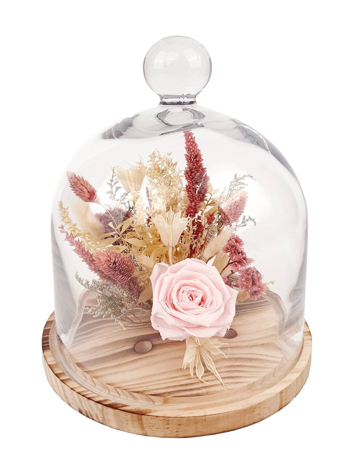 The Andaluca 10 Pink Preserved Rose Botanical Cloche features a real rose with dried flowers, beautifully arranged on a wooden base and showcased under a clear glass cloche with a round handle.