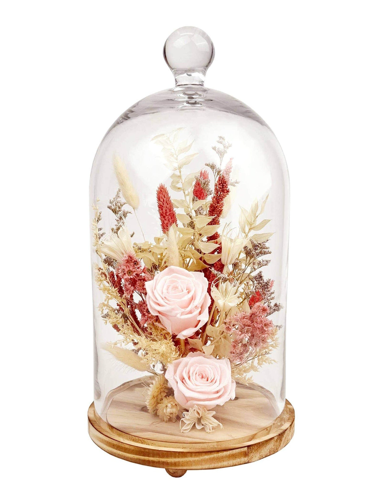 The Andaluca 15 Pink Preserved Rose Botanical Cloche features a real preserved rose and dried flowers in pink and neutral tones, handcrafted and encased under a glass dome with a wooden base.