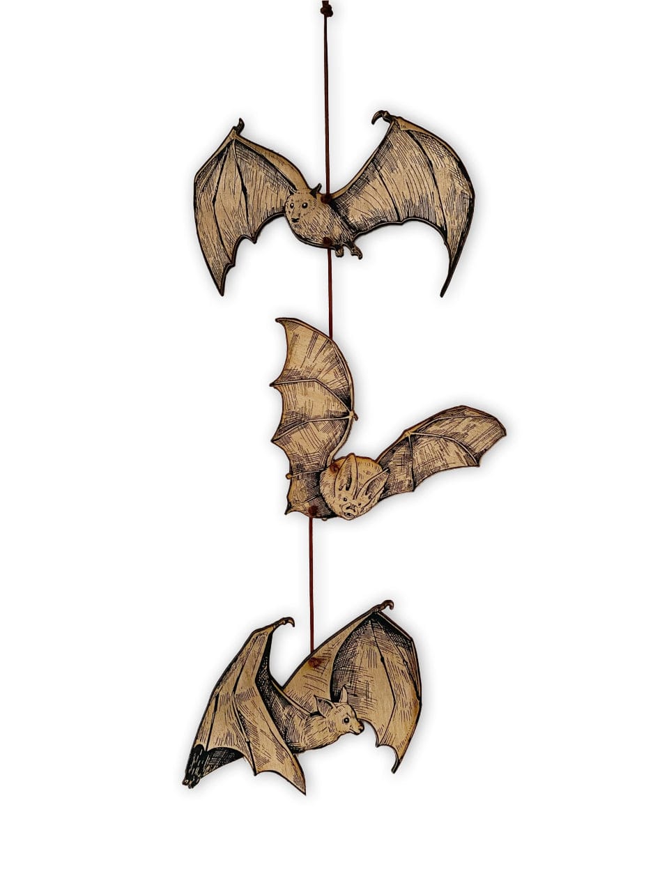 The Bat Garland by CSAcreative features three illustrated, engraved bats with detailed wings and expressive faces, hanging vertically from a thin string—ideal for adding striking spooky decor to any space.