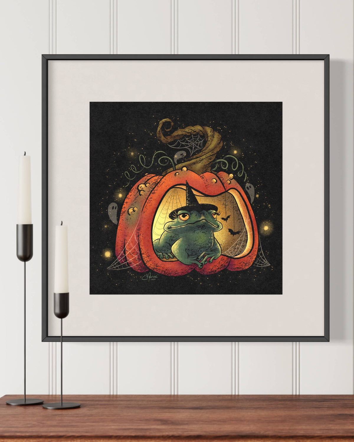 The My Hoppy Place Art Print (8x8) by Elissa Marie Creative features a toad witch in a glowing jack-o-lantern, surrounded by ghosts, bats, webs, and candlesticks in an enchanted forest—perfect Halloween décor.