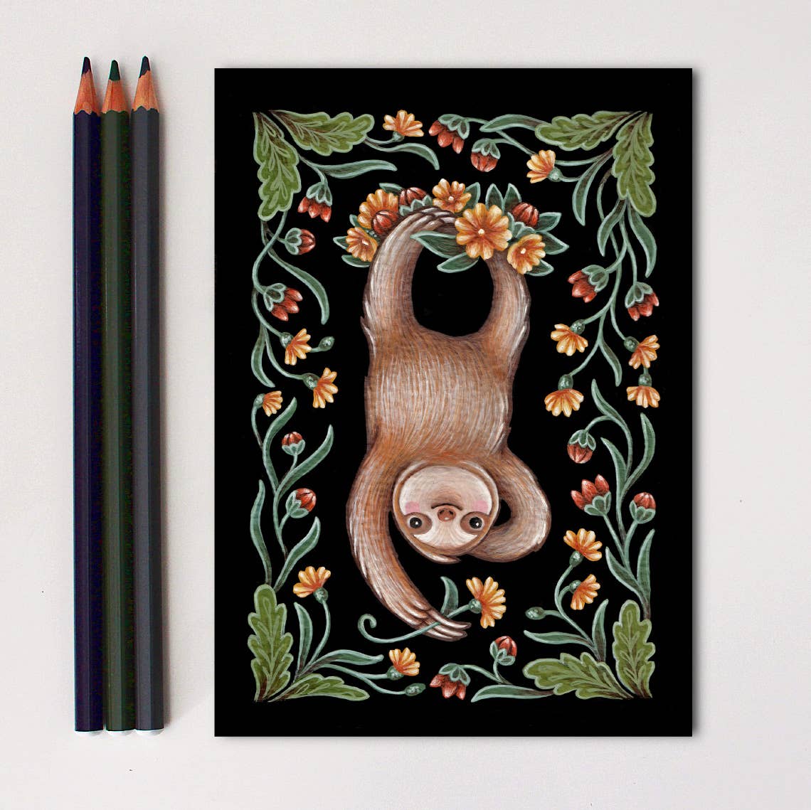 The *Retiring* Sloth Folk Art Print by Faina Lorah features a whimsical sloth hanging upside down among orange flowers and green leaves on a black background, shown alongside three colored pencils. Multiple sizes available.