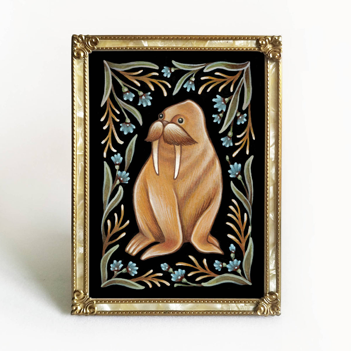 The *Retiring* Walrus Folk Art Print by Faina Lorah is a whimsical watercolor of an upright walrus with leafy branches and blue flowers on black, in cartoon style. A gold frame completes this elegant, decorative piece, available in multiple sizes.