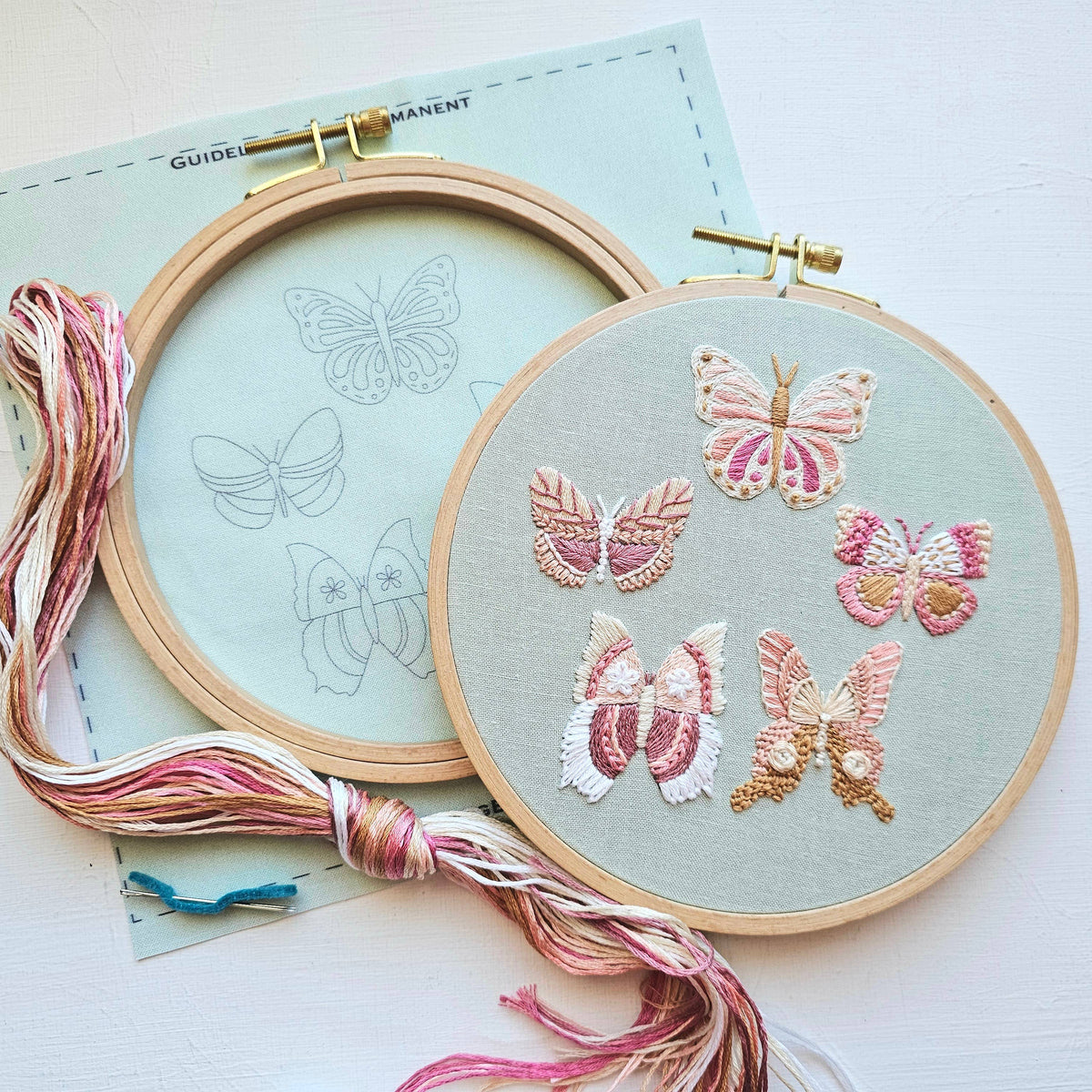 The Jessica Long Embroidery 6 Butterfly Embroidery Kit features pastel embroidered butterflies, a butterfly sampler pattern guide, and pastel threads—making it the perfect beginner embroidery kit.