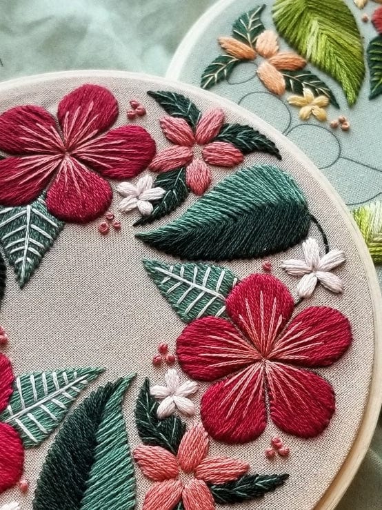 A close-up of detailed, textured floral stitching in vibrant colors from the 5 Beginner Taupe Floral Flourish Embroidery Kit by Jessica Long Embroidery—ideal inspiration for your next floral craft project.