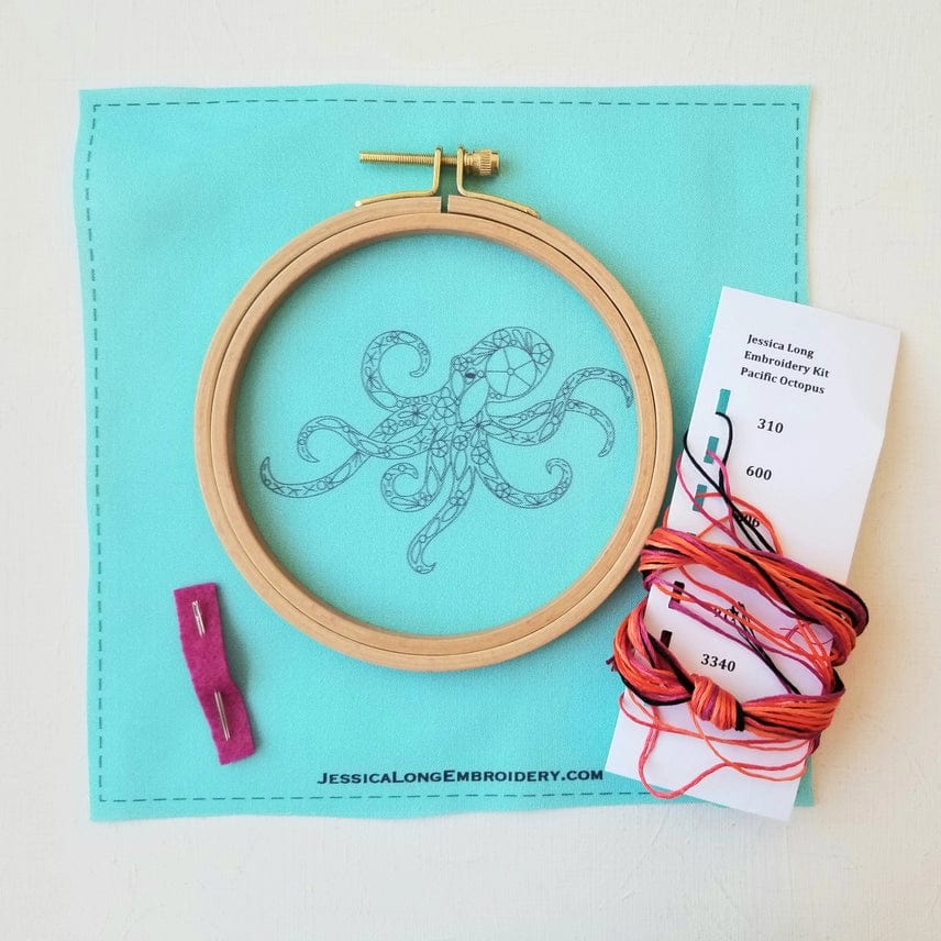 The 5 Beginner Pacific Octopus Embroidery Kit by Jessica Long Embroidery includes aqua fabric with an octopus outline, wooden hoop, needle, colorful floss, and instructions—perfect ocean sea life wall art for beginners.