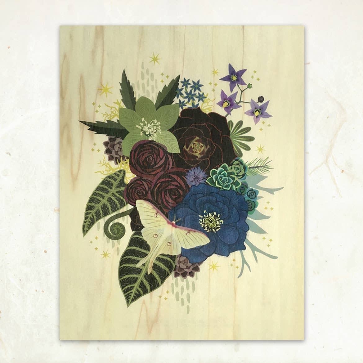 The Luna Moth Bouquet Small Wood Print (11 x 8.5) by Little Gold Fox Designs features a botanical illustration of blue and dark flowers, purple blossoms, green leaves, and a pale moth on sustainable wood—ideal for eco-conscious art lovers.