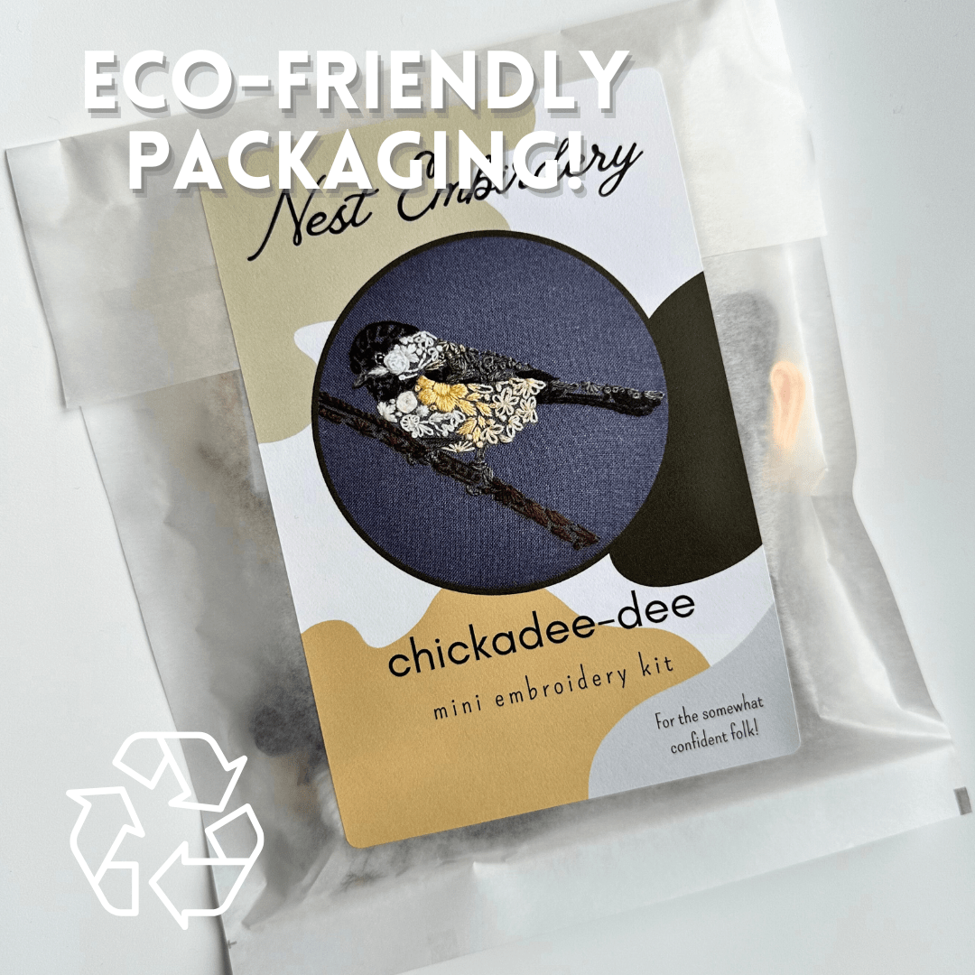 Nest Embirderys 4 Beginner Chickadee-dee Embroidery Kit features a black-capped chickadee design and comes in a translucent eco-friendly bag labeled ECO-FRIENDLY PACKAGING, with a recycling symbol at the bottom left.