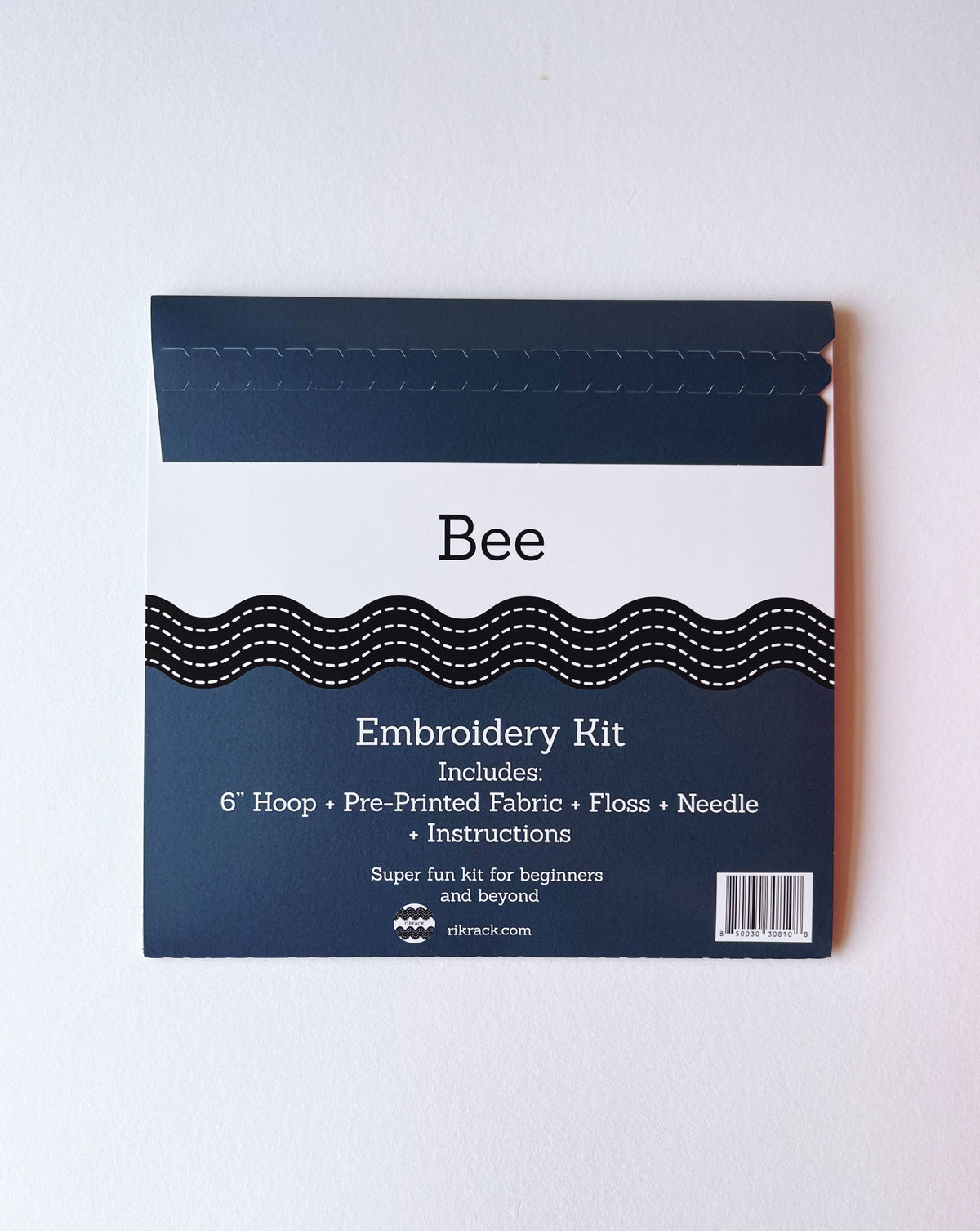 The Rikrack *Late May Pre-Order* 6 Beginner Bee Embroidery Kit includes a hoop, pre-printed fabric, floss, needle, and instructions—perfect for beginners and fun for all skill levels.