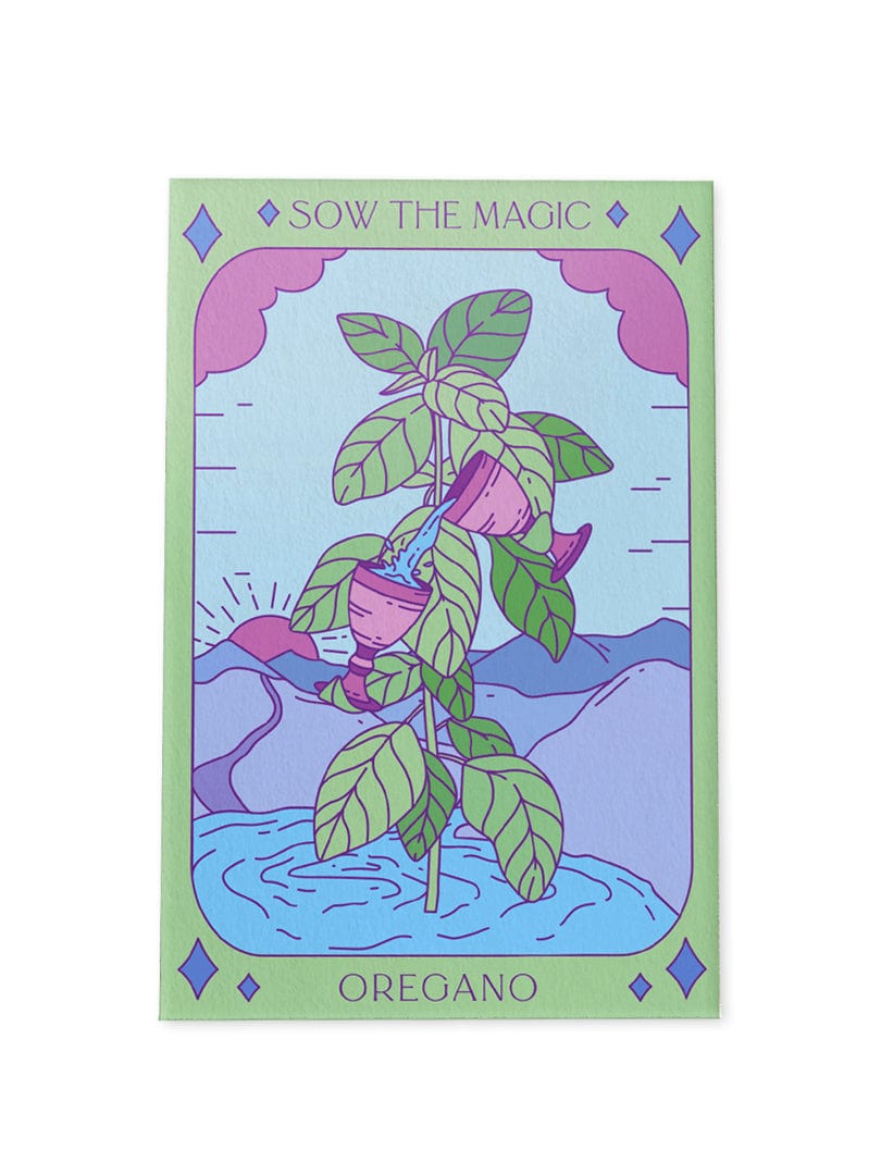 The “Oregano Tarot Garden Seed Packet” by Sow the Magic features a vibrant card with the oregano herb, watered by a floating can before pastel mountains and sky, topped with the brand name and “Oregano Seeds” below.