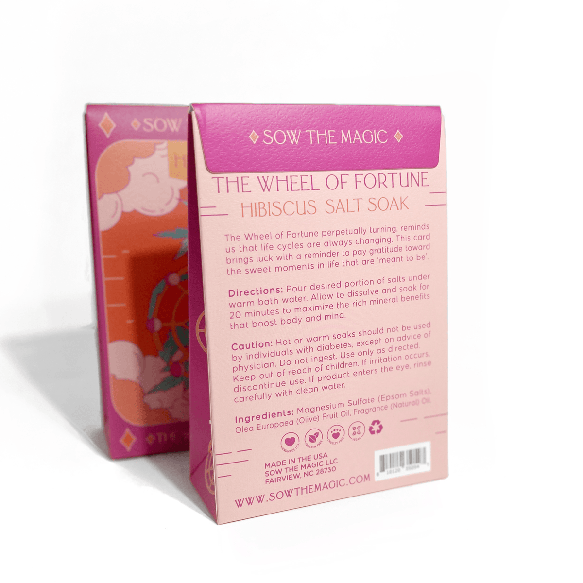 A pink box labeled The Wheel of Fortune Salt Soak in Hibiscus by Sow the Magic features directions, caution, mineral benefits, ingredients, branding details, decorative designs, and a partial illustration on the side.
