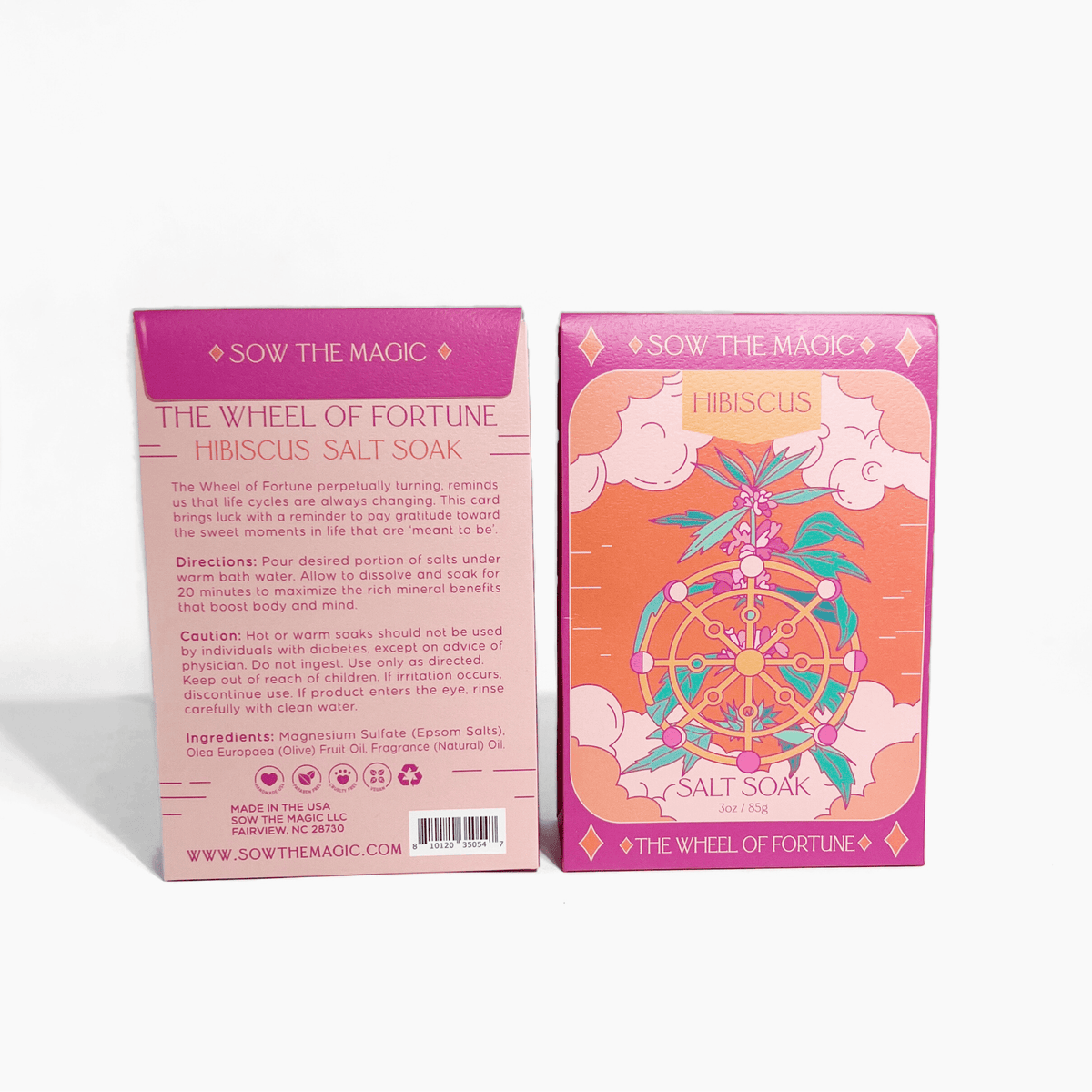 Two boxes of Sow the Magics The Wheel of Fortune Salt Soak in Hibiscus are shown—one displays vibrant Wheel of Fortune-themed floral art, while the other details the mineral benefits and use instructions on a pink background.