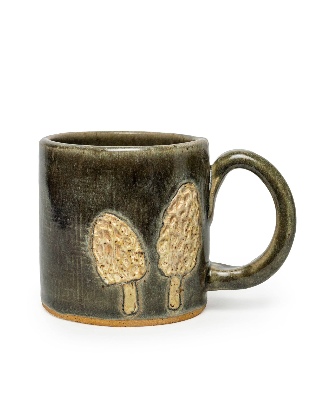 The White Squirrel Clayworks Morel Mushroom Design Ceramic Mug, 10oz, features two textured beige morel mushrooms on a dark green glaze with a round handle—a unique handmade mug for any collection.